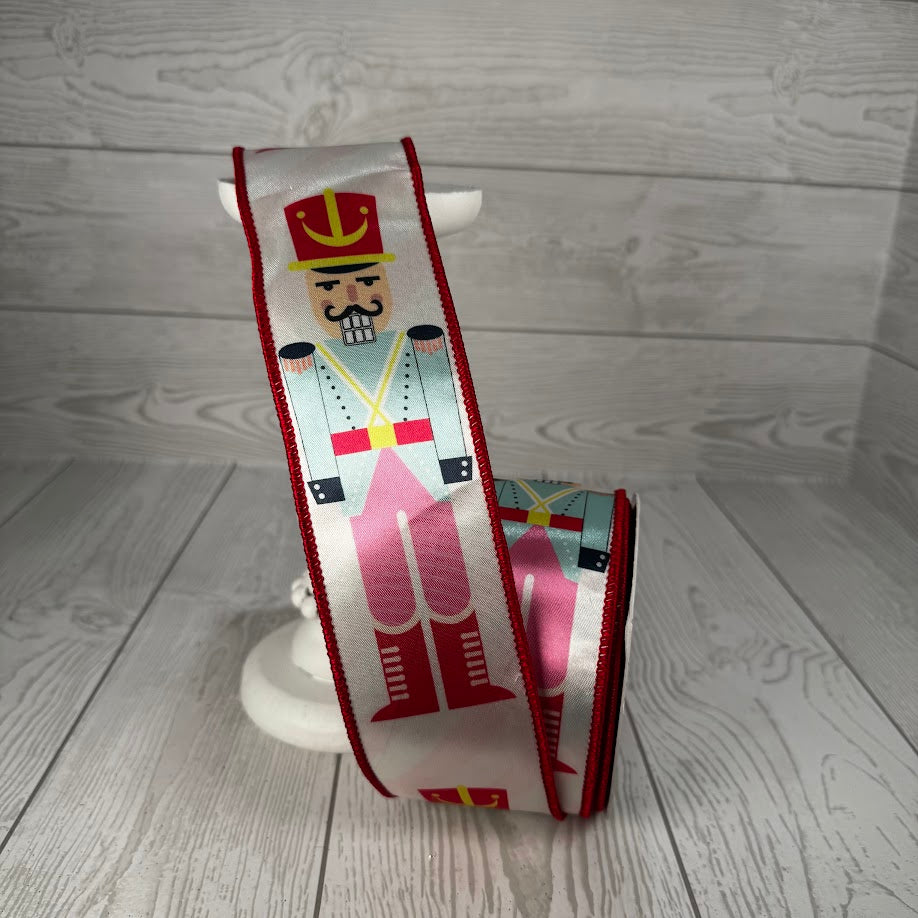 2.5"X10YD PASTEL NUTCRACKER ON SATIN RIBBON - PINK/BLUE/RED - DCR5731